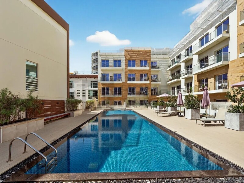 Apartment for Sale in Oxford Residence 1 - Jumeirah Village Circle, Dubai - High ROI | Prime Location | Amazing Pool View at 9900000 AED